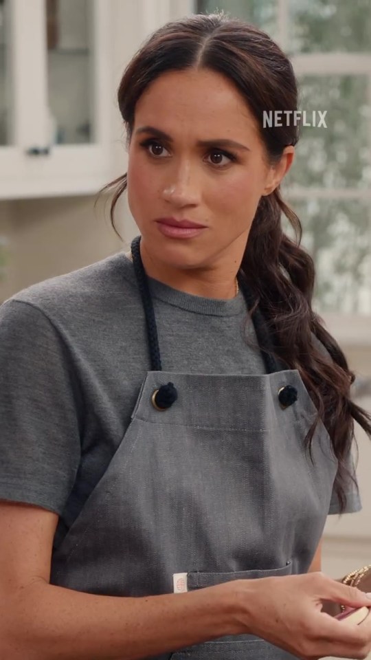 Meghan Markle in a gray apron from her Netflix show.