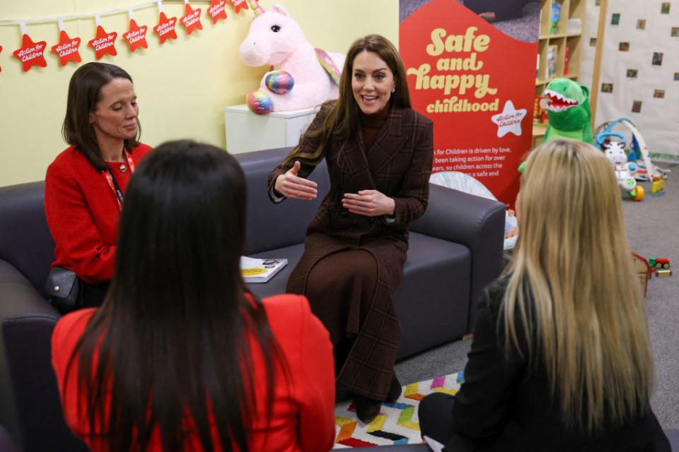 Catherine, Princess of Wales visits HMP Styal on Feb. 11 in Cheshire, England, tartan coat, Blaze Milano, burgundy