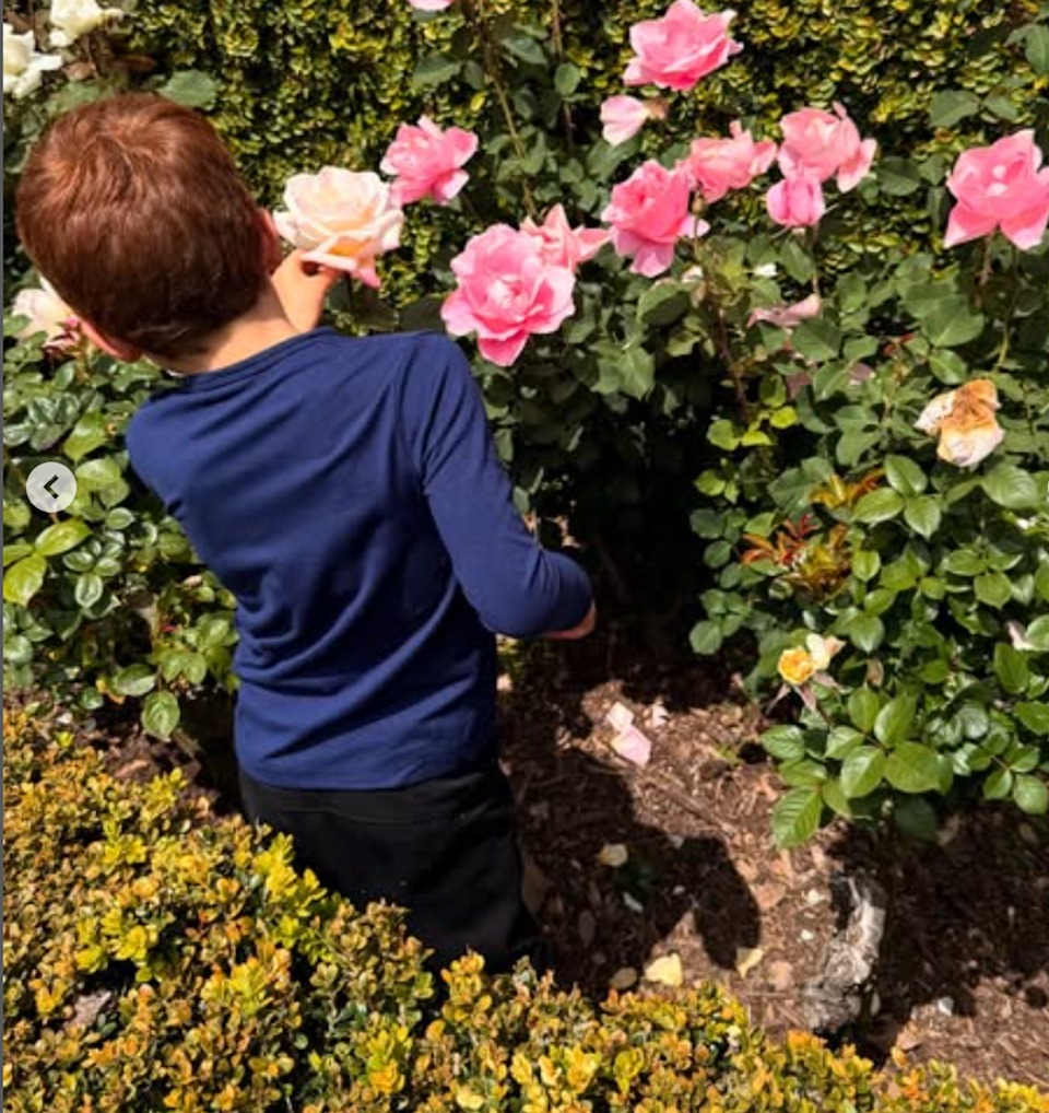 Meghan Markle's son Archie picking flowers in the garden (@meghan / Instagram)