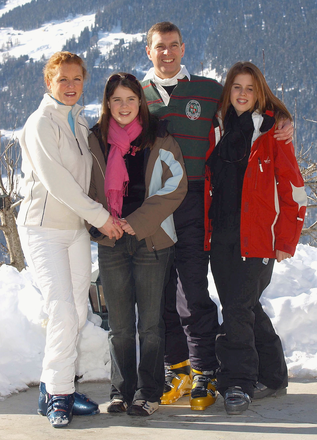 The Duchess of York, Princess Eugenie, the Duke of York and Princess Beatrice attend a photocall on February 18, 2003 in Verbier, Switzerland. Prince Andrew will celebrate his 43rd birthday on February 19
