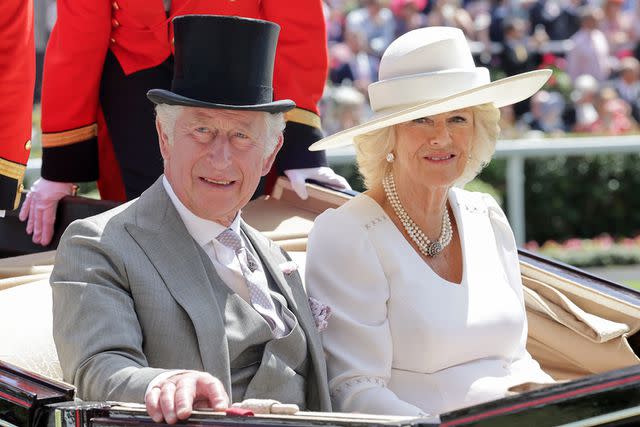Chris Jackson/Getty Images King Charles, then Prince of Wales, and Queen Camilla, then Duchess of Cornwall, arrive into the parade ring on the royal carriage as they attend Royal Ascot 2022 at Ascot Racecourse on June 15, 2022 in Ascot, England