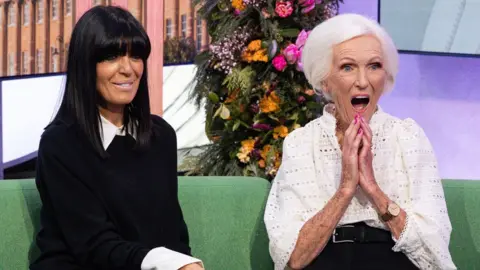 Claudia Winkleman with Dame Mary Berry on the One Show, Dame Merry's mouth open in amazement