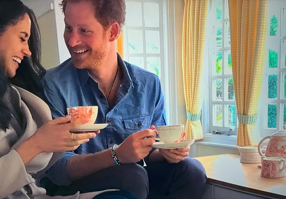 Harry and Meghan drinking tea.