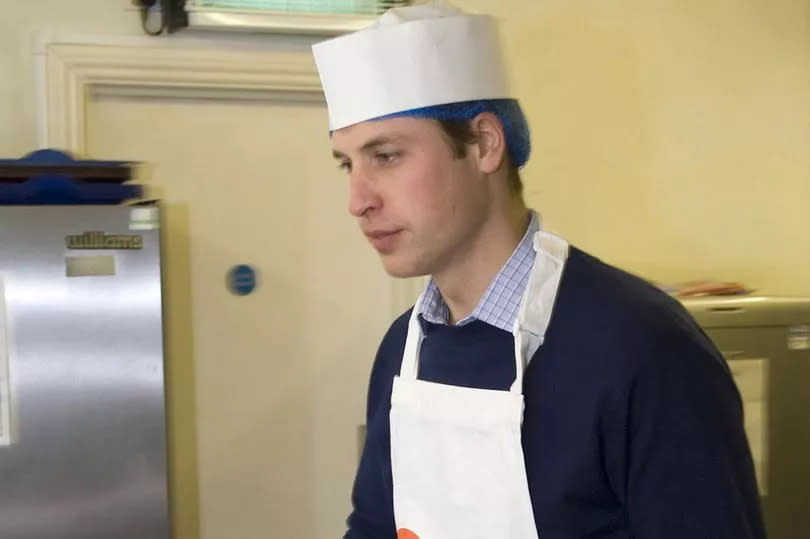 Hello! magazine undated handout photo of Prince William, serving a full English breakfast to the homeless at Christmas at CentrePoint's London kitchen