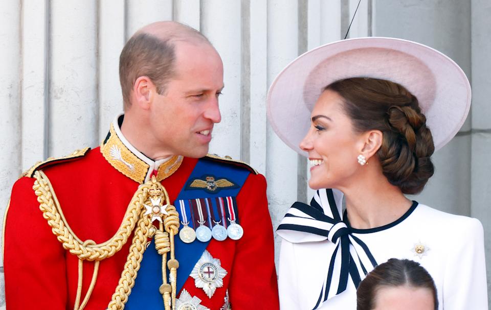 Kate Middleton and Prince William smiling on the balcony of Buckingham Palace during Trooping the Colour 2024