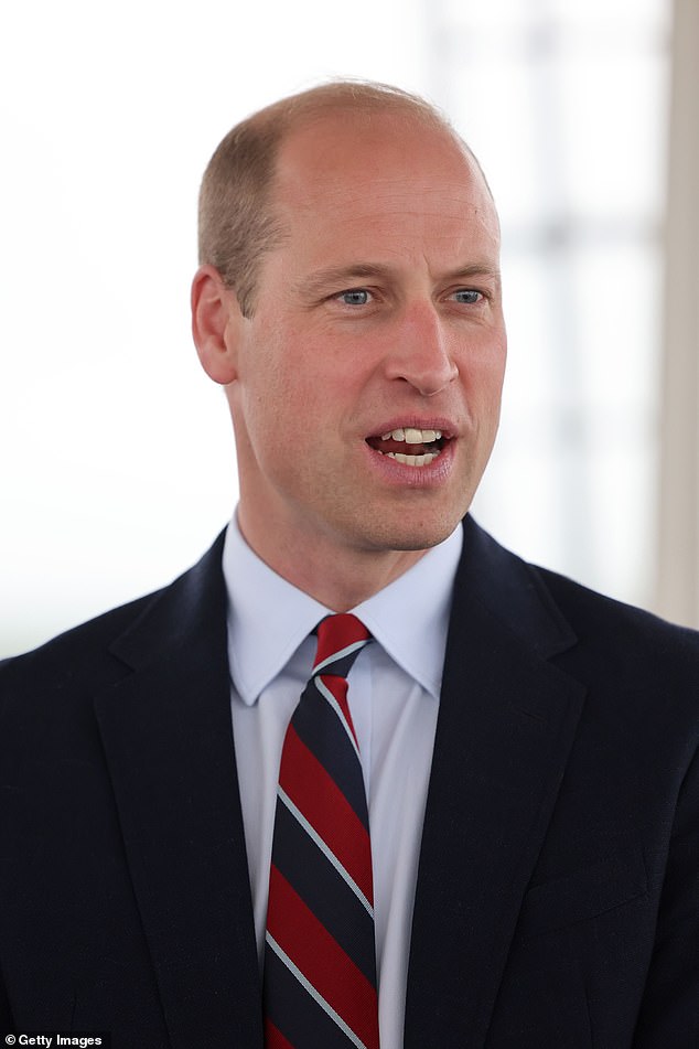 The royal opted for a red, black and white tie for the occasion as he made a visit to RAF Valley today