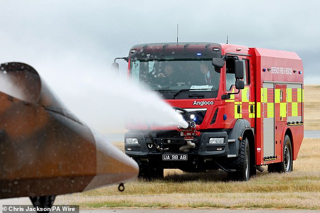 The Prince of Wales, Royal Honorary Air Commodore, RAF Valley, takes part in a simulated fire response exercise