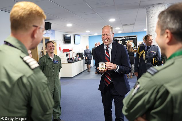 Prince William, Prince of Wales talks to RAF personnel during an official visit at RAF Valley