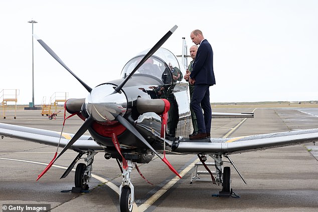 He stood on the wing as he explored the RAF Short Tucano trainer aircraft