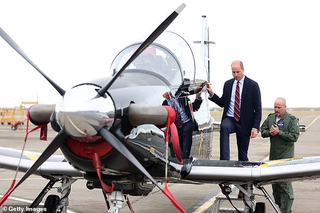 Prince William, Prince of Wales gets an introduction to a RAF Short Tucano trainer aircraft