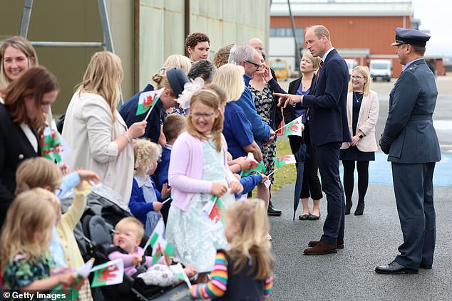 Prince William, Prince of Wales talks to members of the public during an official visit at RAF Valley
