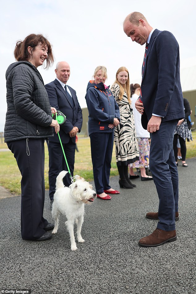 The prince was delighted to meet a dog at RAF Valley, who hadn't expected to encounter royalty on her walk!