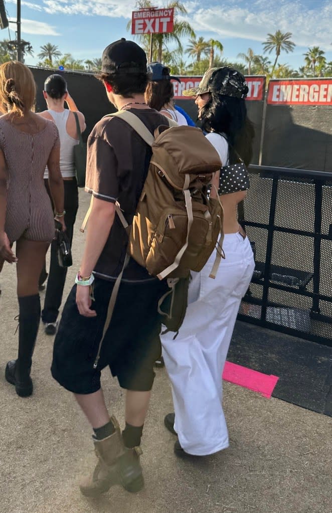 They walked amongst a crowd. BACKGRID