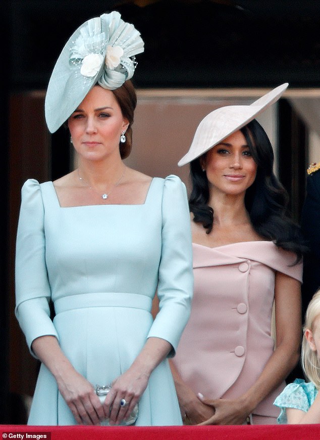 Kate and Meghan, pictured standing on the balcony of Buckingham Palace during Trooping The Colour in 2018, had totally different approaches to royal life, according to staff