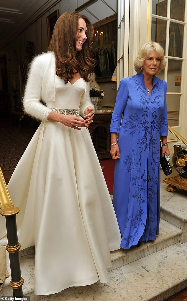For the evening reception, Kate changed from her iconic ivory lace gown into a silk A-line number topped with a fluffy bolero, designed by Sarah Burton for Alexander McQueen