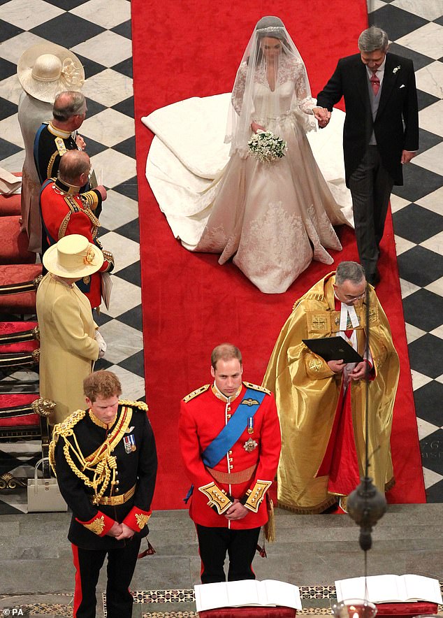 Michael Middleton holds his daughter's hand as they approach the altar
