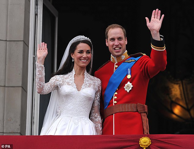 The newly married couple wave to roaring fans from the Buckingham Palace balcony