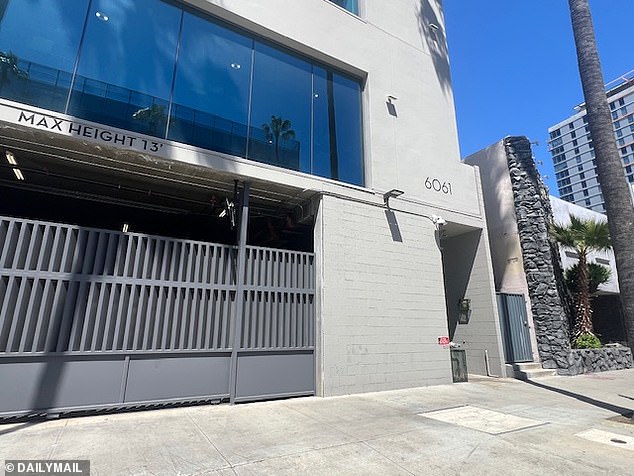 The grey three-story office building appears to be attached to a Netflix studio lot and is at the less-salubrious end of Sunset Boulevard next to a sleazy-looking motel