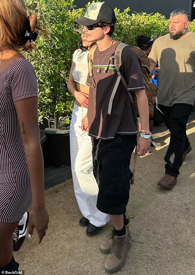 Kylie Jenner and Timothee Chalamet were seen warmly holding hands as they strolled through Coachella on Saturday