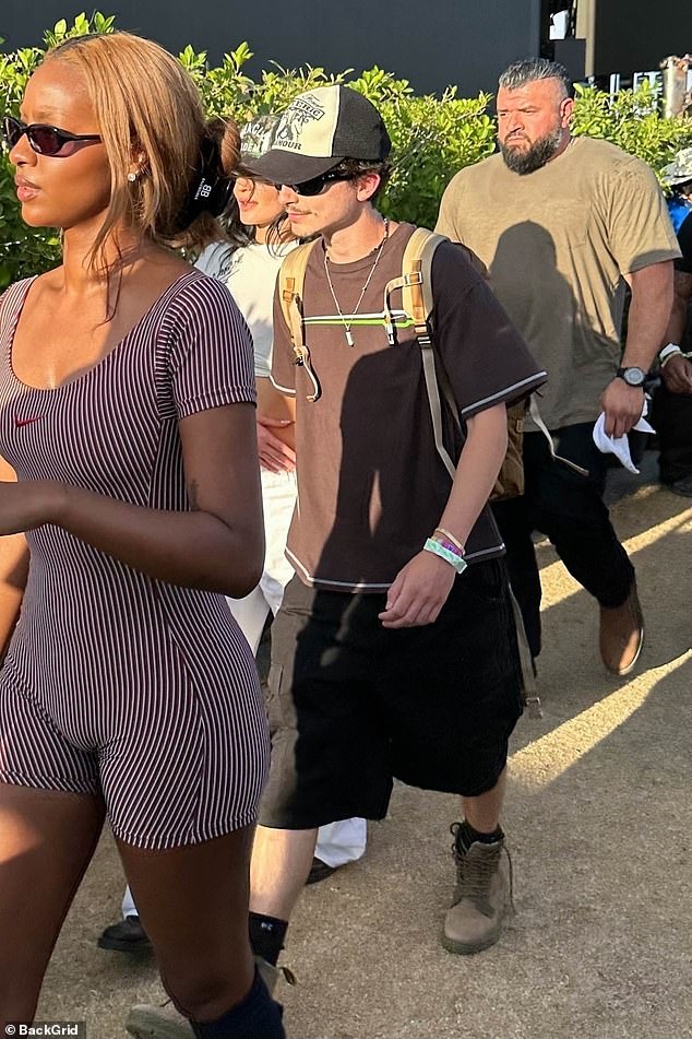 While Kylie bared her enviably taut midriff in a sleek white ensemble, Timothee modeled a trendily baggy set of shorts with a t-shirt, shades and a baseball cap