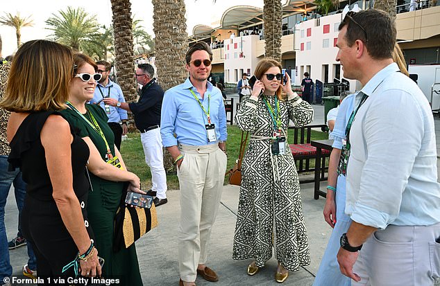In one photograph from the F1 Grand Prix of Bahrain on Sunday, Beatrice and Eugenie appeared at first glance to be standing alongside only Edo. But Peter and his partner were also in the frame, facing away from the camera (pictured right)