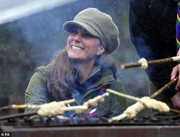 Kate was seen cooking bread twists around a campfire, during her visit to the and Cub Scouts at the Great Tower Scout Camp near Newby Bridge in Cumbria, 2013