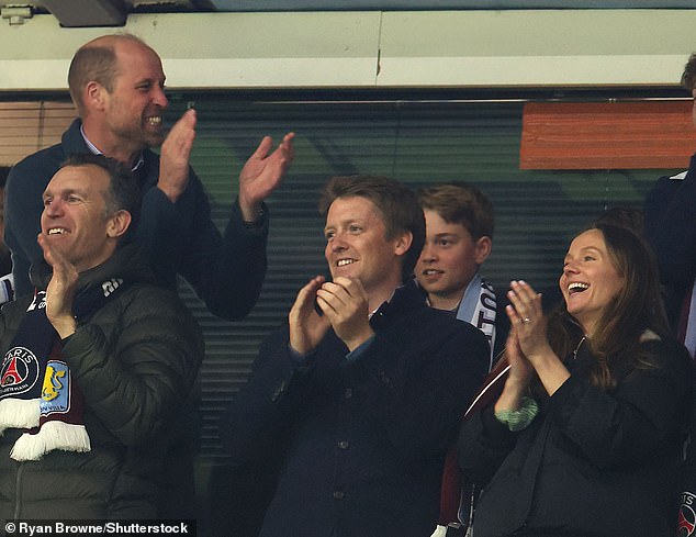 Hugh and his wife Olivia (pictured far right) applauded after Aston Villa scored their second goal at yesterday's match in Birmingham