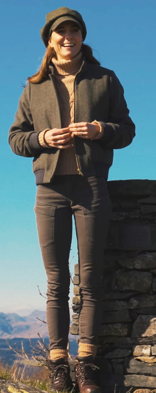 But she opted to wear a tweed bomber jacket and skinny jeans topped with a don’t-look-at-me baker boy hat on visit to the Lake District with a group of scouts earlier this month