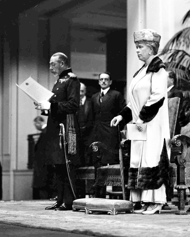 Britain’s King George V reads his opening speech when he...