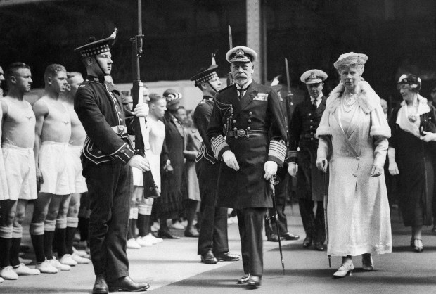 King George V and Queen Mary of England pass the...