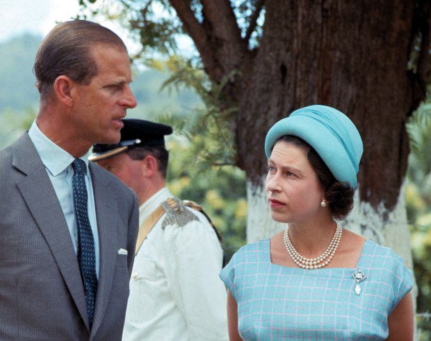 Britain’s Queen Elizabeth II and her husband Prince Philip are...