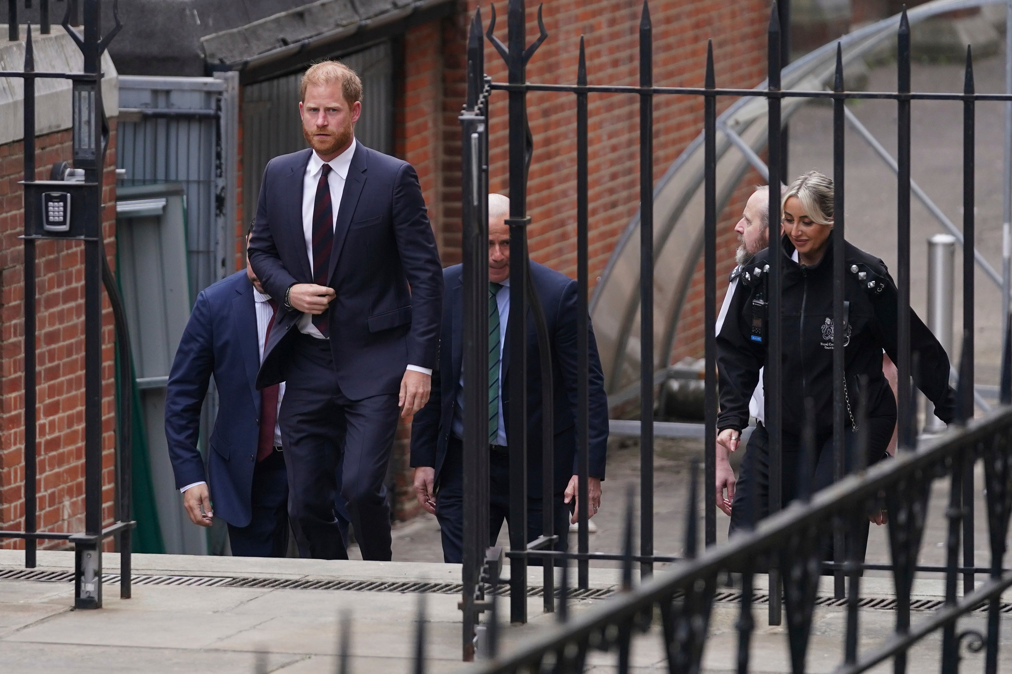 Harry attended both days of the hearing in April, and could be seen taking notes and talking with his legal team during the appeal.