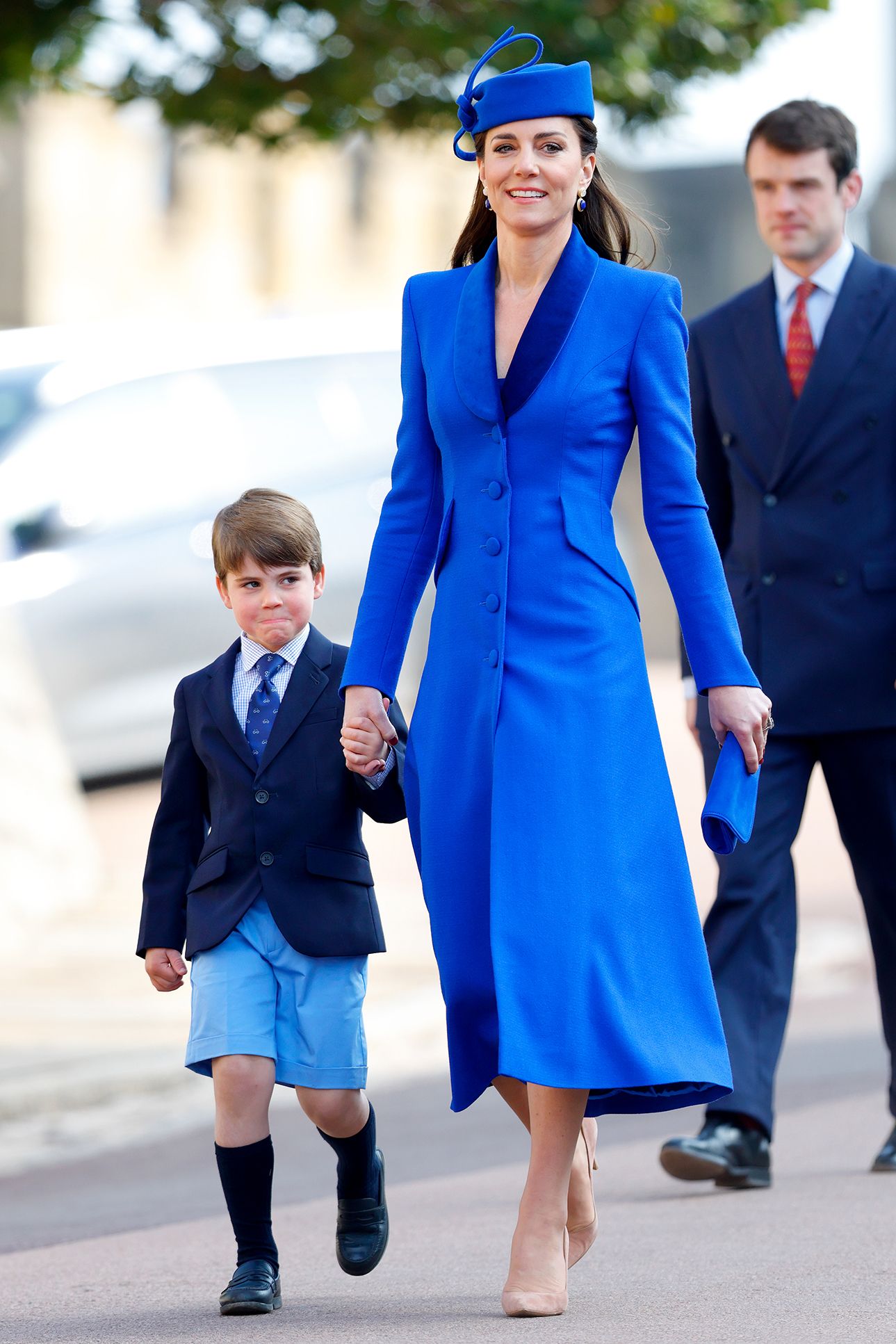 Image may contain Person Walking People Clothing Footwear Shoe Adult Child Accessories Formal Wear Tie and Coat