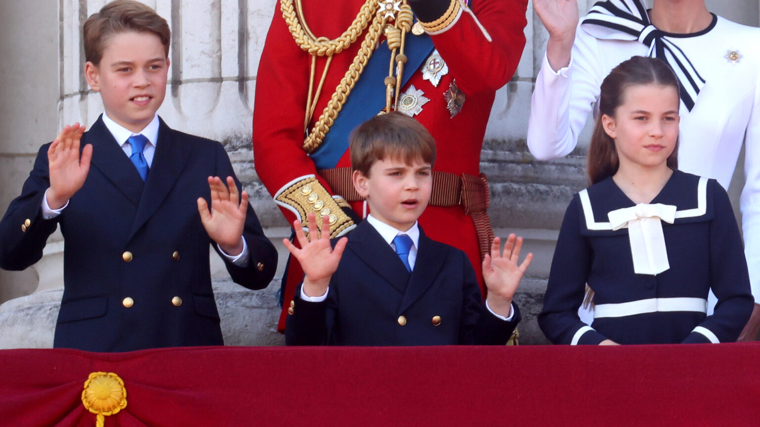 How Prince George, Princess Charlotte, and Louis Secretly Spent Easter Prince George, Prince Louis and Princess Charlotte wearing navy outfits waving on the balcony of Buckingham Palace with their parents standing behind them