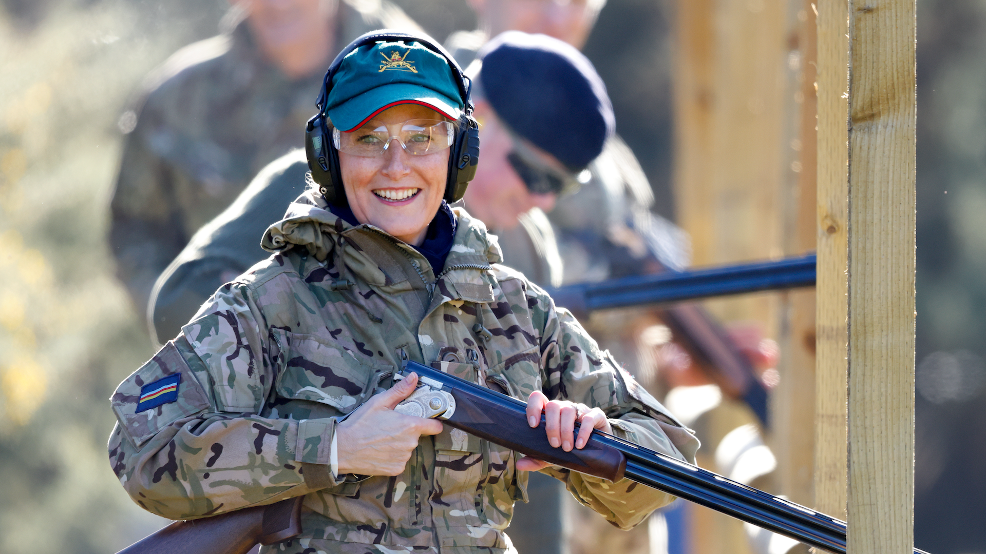 Sophie, Countess of Wessex wears a pair of ear defenders, safety glasses and baseball cap as she (using a Beretta shotgun) takes part in a clay pigeon shoot during the Countess of Wessex Cup at Gibraltar Barracks on February 7, 2023 in Camberley, England