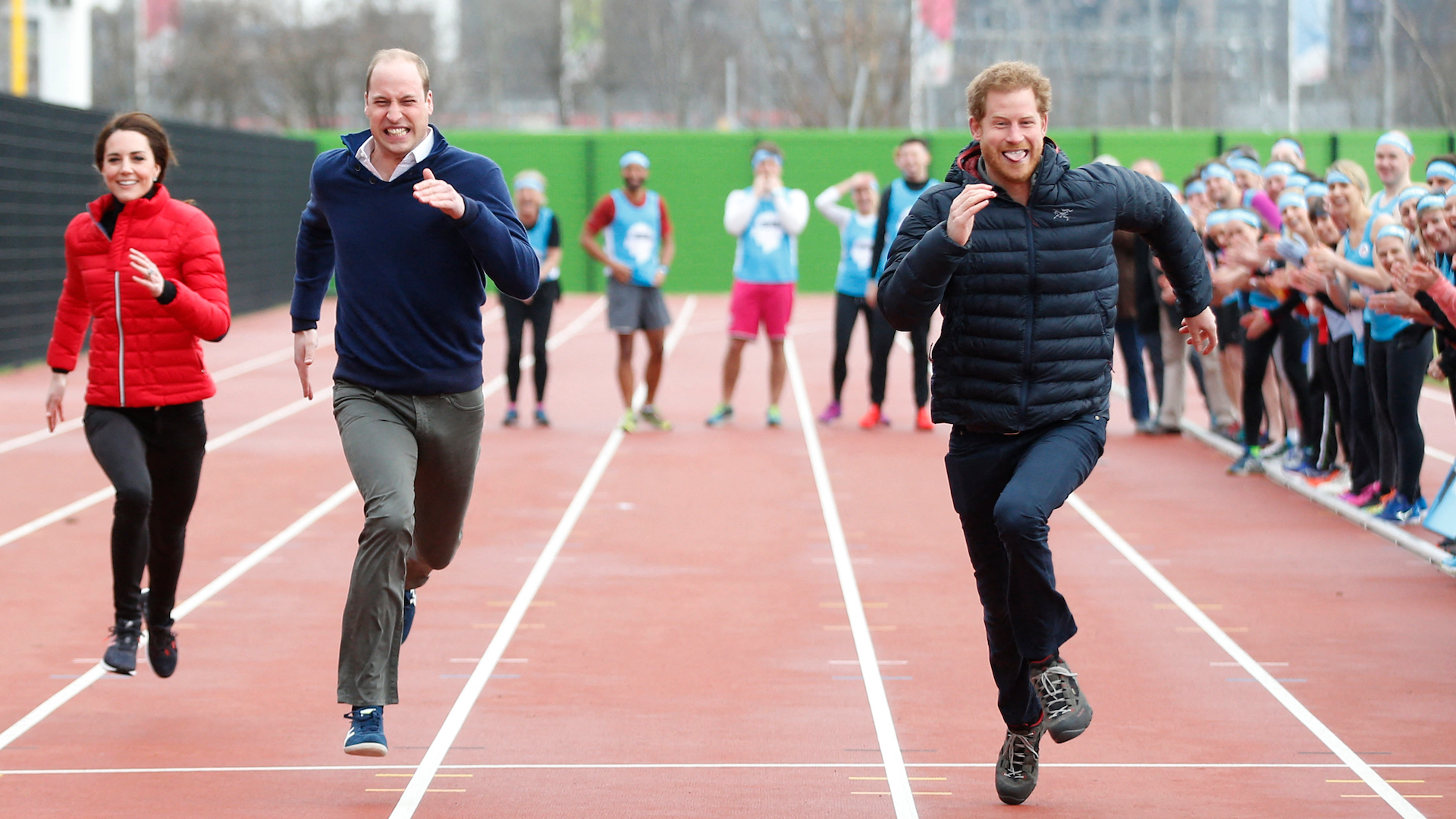 Britain's Catherine, Duchess of Cambridge (L), Britain's Prince William, Duke of Cambridge (C) and Britain's Prince Harry (R) take part in a relay race, during a training event to promote the charity Heads Together, at the Queen Elizabeth Olympic Park in London, on February 5, 2017
