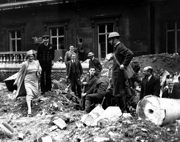 Queen Mother Elizabeth, left, steps over the debris left by...