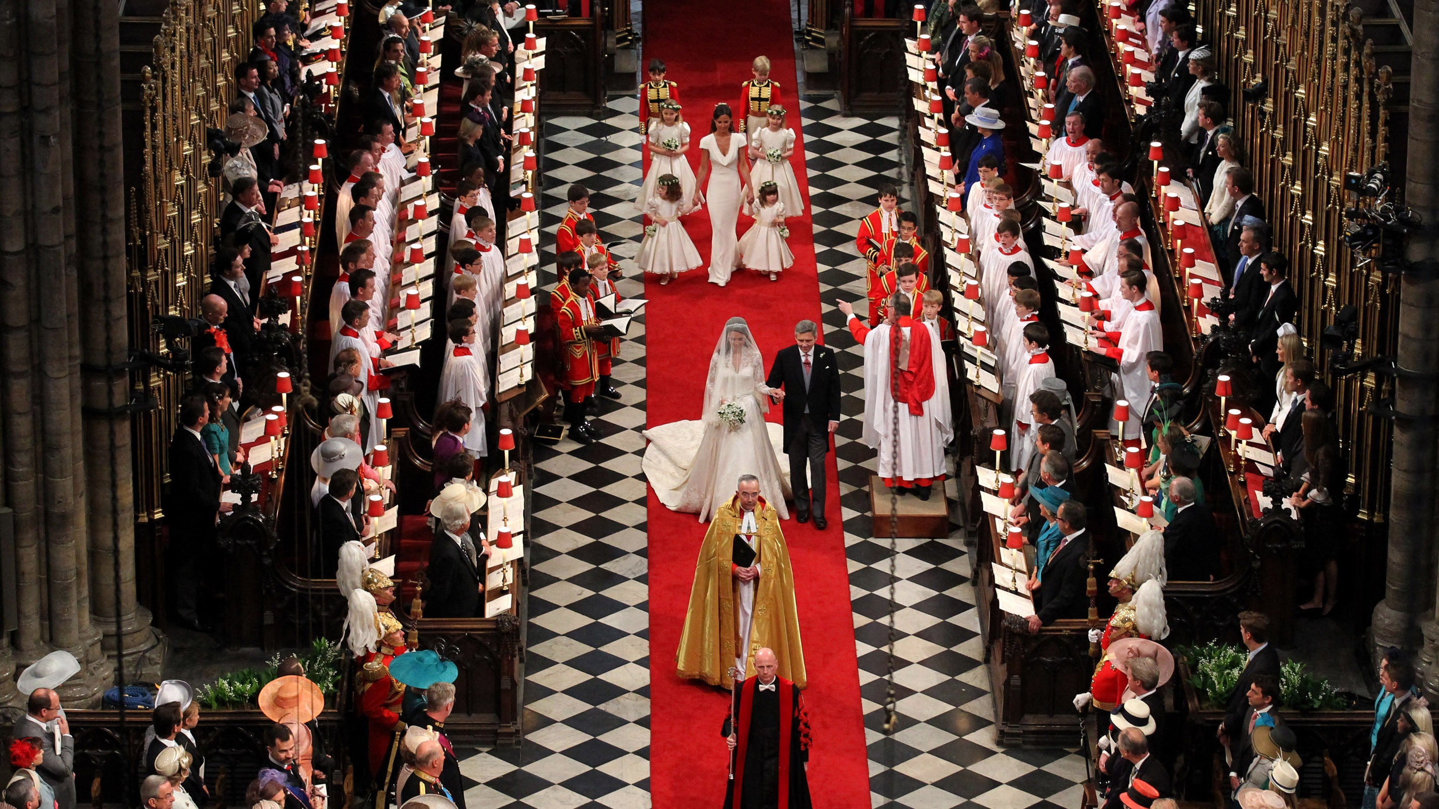 Kate Middleton walks down the aisle accompanied by her father Michael Middleton at Westminster Abbey during her royal wedding