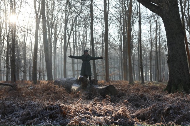 Princess of Wales Kate Middleton stood on a tree stump with her arms out, a picture taken by Prince Louis and released for World Cancer Day