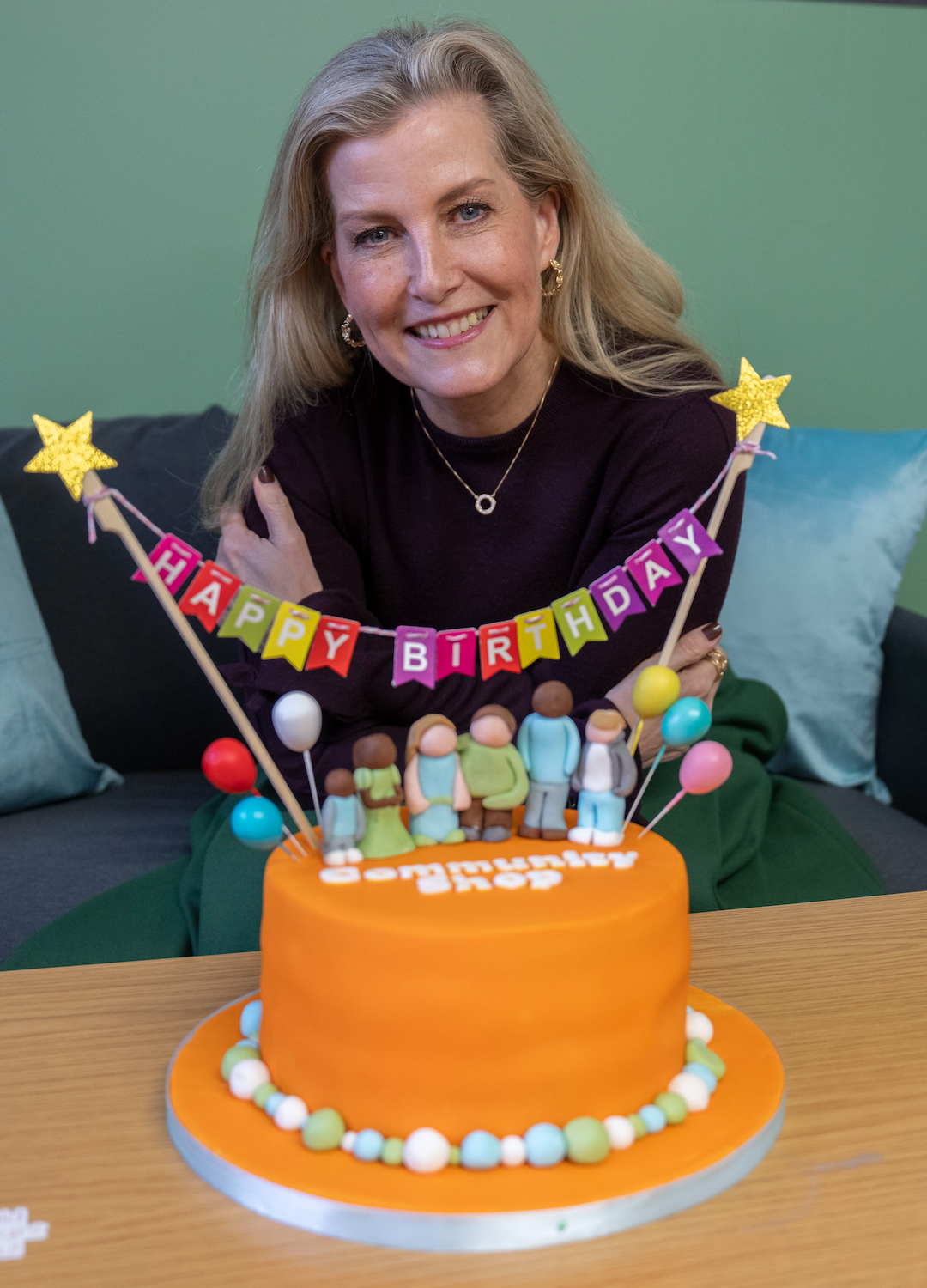 Sophie, Duchess of Edinburgh receives a cake ahead of her 60th birthday during a visit to 