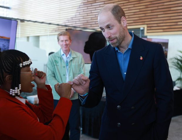CAPE TOWN, SOUTH AFRICA - NOVEMBER 07: Prince William, Prince of Wales meets Anga Mbeyiya Founder and CEO of Ole Blu she made the Prince make a pinky promise to come and visit her business, which makes Seaweed products, during a visit to meet seaweed businesses from the region to celebrate local innovation and to learn about the potential for it to repair and regenerate the planet at Portside Tower on November 07, 2024 in Cape Town, South Africa. During his visit, The Prince of Wales attended the fourth annual Earthshot Prize Awards and engaged in various environmental initiatives and participated in events held in Cape Town as part of 'Earthshot Week'. (Photo by Ian Vogler - Pool/Getty Images)