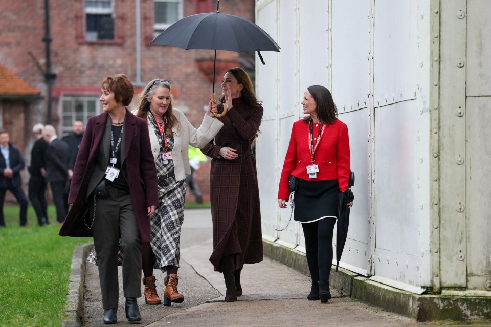 Princess Catherine walking with staff at a mother and baby unit in a prison.