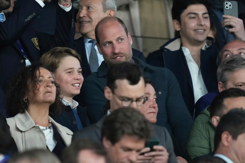 Prince William and his son at a soccer match.