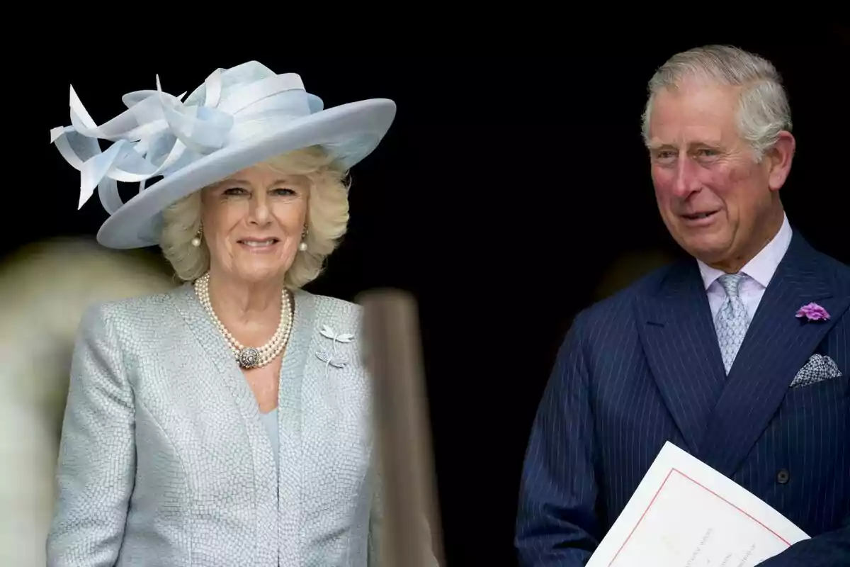 Camila Parker and Carlos III dressed elegantly, a woman with a light blue hat and a man in a dark blue suit, both smiling.