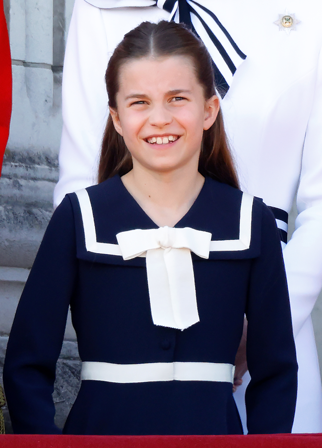 Princess Charlotte of Wales watches an RAF flypast from the balcony of Buckingham Palace after attending Trooping the Colour on June 15, 2024 in London, England