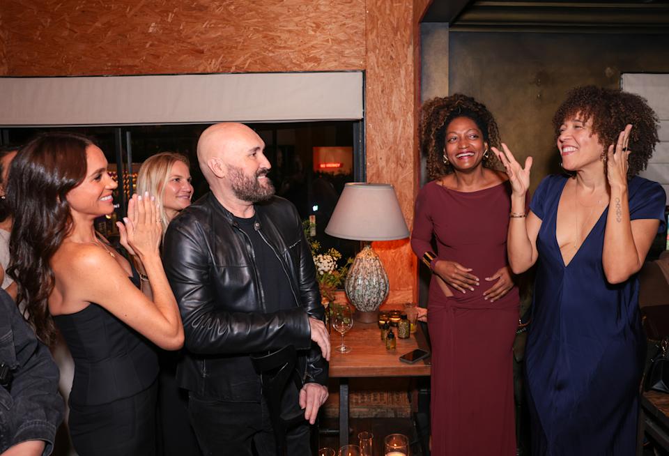 Meghan Markle, Serge Normant, Kadi Lee laughing and clapping at a party for Highbrow Hippie