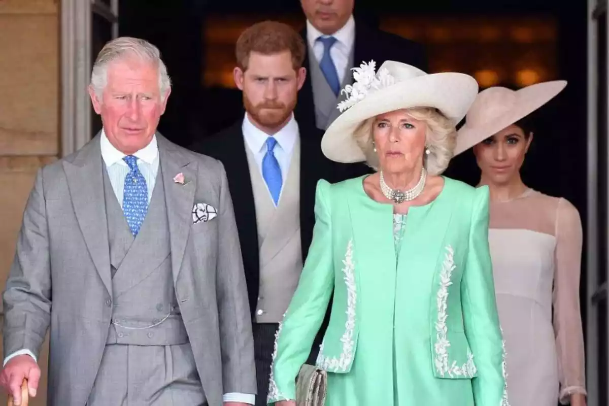 Photo of the British Royal Family showing from left to right King Charles III, Prince Harry, Queen Camilla and Meghan Markle
