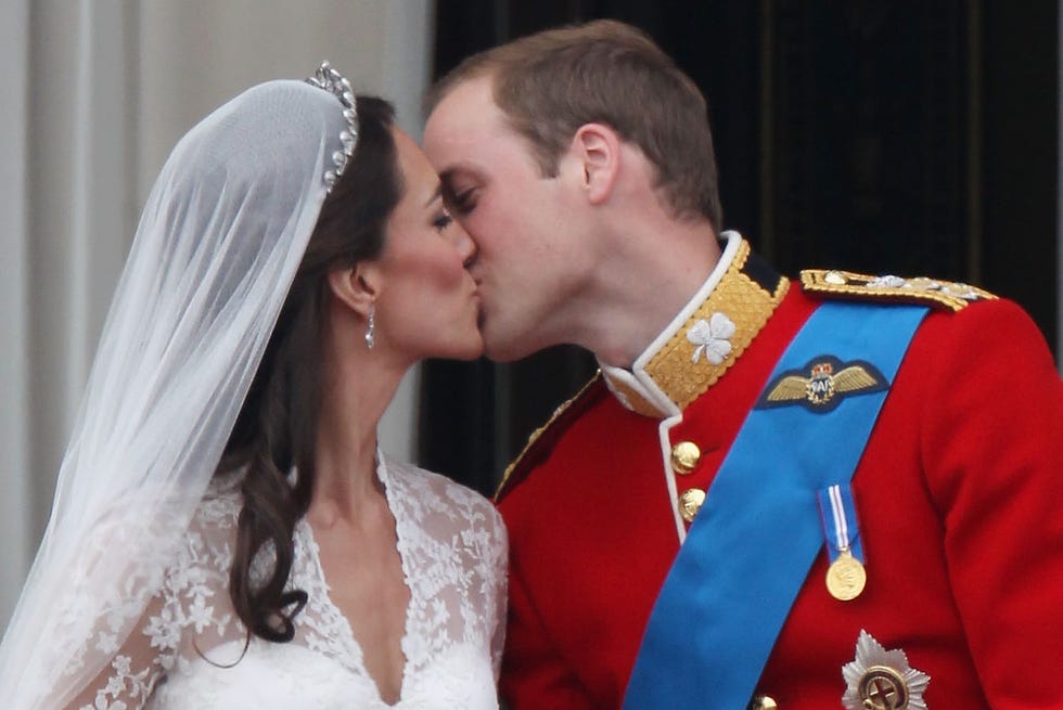 Royal Wedding - The Newlyweds Greet Wellwishers From The Buckingham Palace Balcony london, england april 29: their royal highnesses prince william, duke of cambridge and catherine, duchess of cambridge kiss on the balcony at buckingham palace on april 29, 2011 in london, england. the marriage of the second in line to the british throne was led by the archbishop of canterbury and was attended by 1900 guests, including foreign royal family members and heads of state. thousands of well wishers from around the world have also flocked to london to witness the spectacle and pageantry of the royal wedding. (photo by peter macdiarmid/getty images)