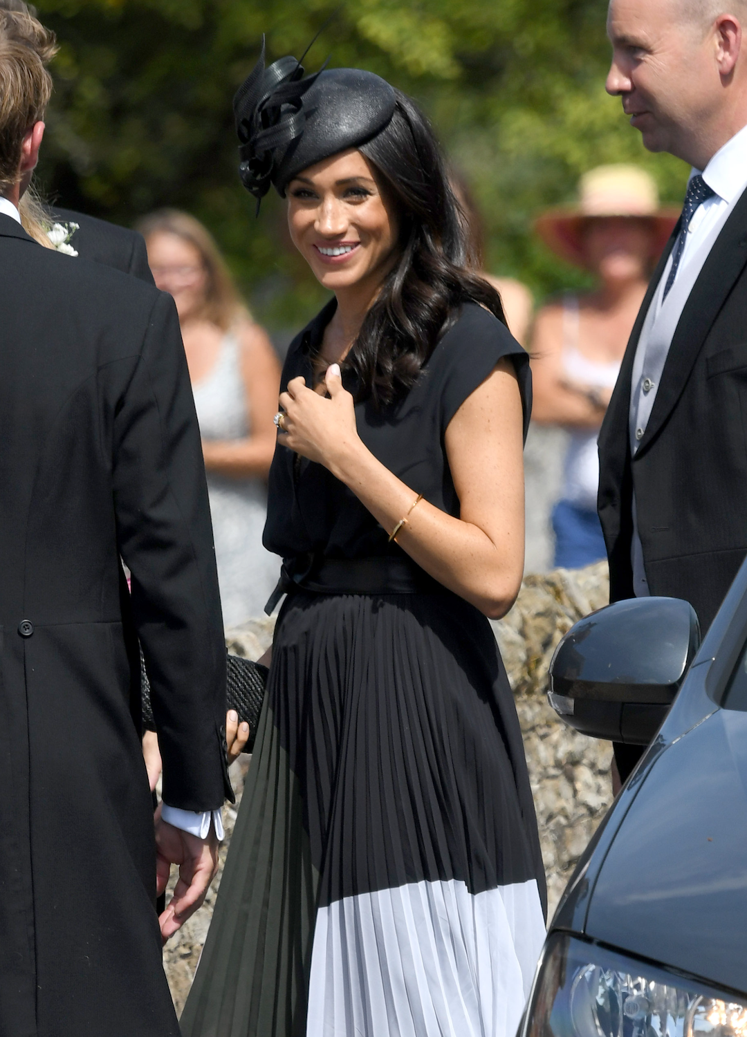 Meghan, Duchess of Sussex attends the wedding of Daisy Jenks and Charlie Van Straubenzee at Saint Mary The Virgin Church on August 4, 2018 in Frensham, United Kingdom