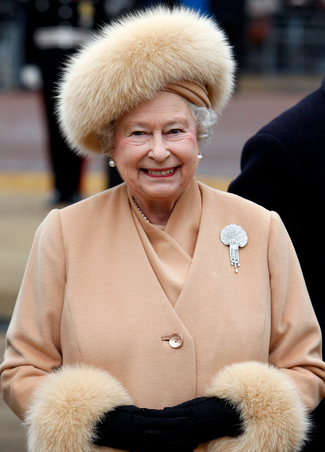 Britain's Queen Elizabeth II arrives to unveil a memorial to Queen Elizabeth, the Queen Mother on the Mall on February 24, 2009 in London, England